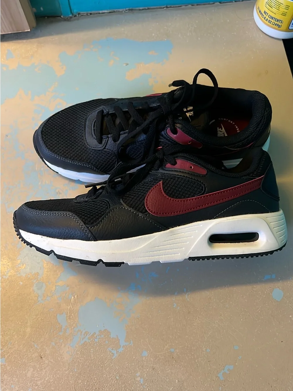 Nike Black Sneakers with Burgundy Swoosh and White Midsole